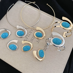 Detail of luxury resin turquoise jewelry set including necklace, bracelet, earrings and ring