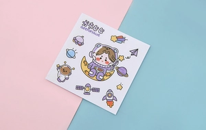 Close-up of cute astronaut theme PVC stickers with space rockets and planet designs