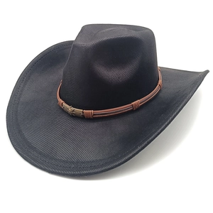 Close-up of black suede cowboy hat with brown leather band and vintage bronze skull buckle