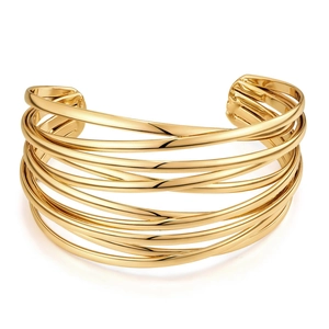 Macro shot of a layered 18K gold-plated cuff bracelet with polished metallic finish