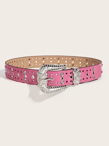 Close-up of pink faux crocodile leather belt with rhinestone butterfly buckle and star studs