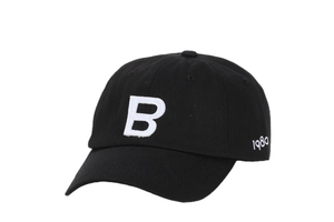 Detail of white embroidered letter B and 1980 on a black cotton canvas baseball cap