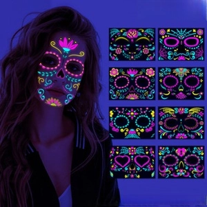 Detail of neon glow Day of the Dead face tattoos featuring vibrant skull patterns