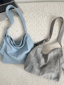 Retro tie-dye canvas hobo bags in blue and grey with adjustable wide straps
