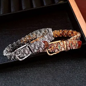 18k gold plated belt buckle bracelet with pavé crystals and green gemstones