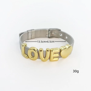 Close-up of adjustable silver mesh bracelet with golden LOVE letters and heart charm