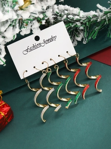 Three pairs of spiral Christmas earrings with gold metal and red green white glitter