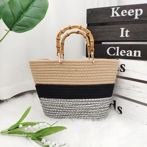 Chic tricolor cotton rope woven tote bag with authentic bamboo handles on soft rug