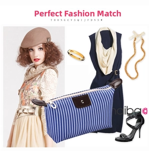 Detail of blue striped waterproof makeup bag with fashion outfit styling suggestions