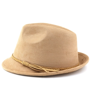 Detail of faux suede western cowboy hat featuring braided band and tassel ornament