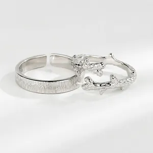 Macro detail of textured wood grain pattern and branch design on S925 silver open rings