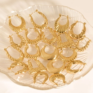 Minimalist irregular stainless steel hoop earrings set with unique textured gold finishes