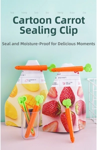 Detailed view of carrot-shaped sealing clips securing dried fruit snack bags in kitchen