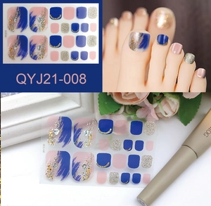 Detail of waterproof pedicure stickers with blue marble texture and gold foil accents