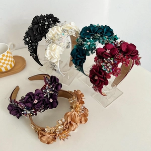 Detailed view of six floral headbands with rhinestones and beadwork in various colors