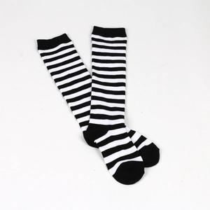 Detailed view of classic black and white striped knitted over-knee socks for kids