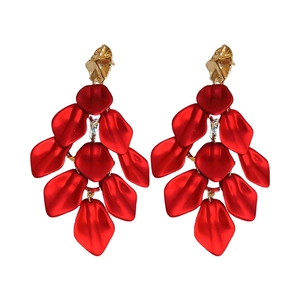 Exaggerated red acrylic flower petal tassel drop earrings with gold studs on white background