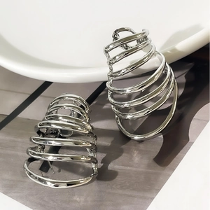 Polished silver layered spiral earrings with architectural minimalist conical design