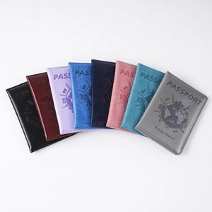 Collection of PU leather passport covers in eight assorted colors with debossed text