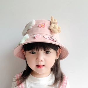 Pink children's bucket hat with 3D plush rabbit and cloud decorations for sun protection