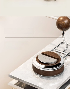 Vacuum suction base detail of kitchen roll holder with walnut wood and chrome finish
