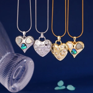 Snake chain necklace with heart shield pendant featuring zircons and shell inlays