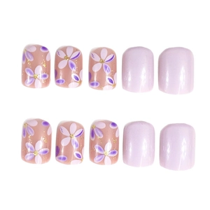 Short square press-on nails with purple floral patterns and solid light purple finish