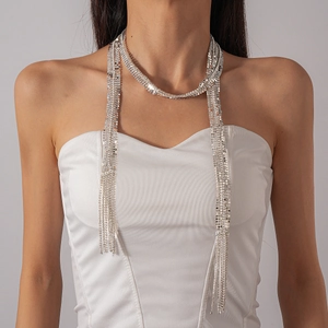 Close-up of silver tassel necklace with multiple strands in a scarf-style drape