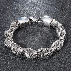 Macro shot of silver stainless steel twisted mesh snake chain bracelet with fine texture