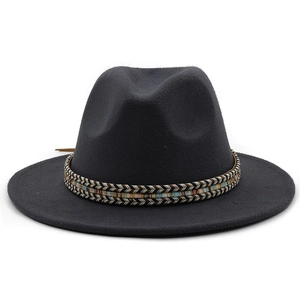 Detail of wide brim wool fedora hat featuring ethnic style woven band decoration