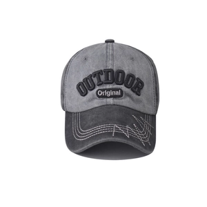 Close-up of high-quality complex 3D embroidery and stitching on washed vintage baseball cap
