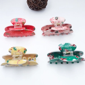 Christmas themed PVC hair claws with reindeer, snowman and Santa patterns for women
