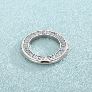 Detailed shot of silver hollow ring accessory featuring inlaid rectangular clear gemstones