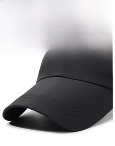 Detail of reinforced stitching on stiff black baseball cap brim with white geometric logo