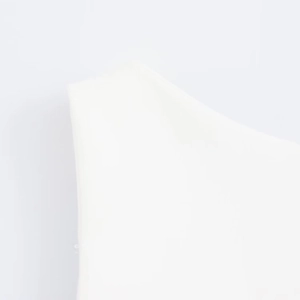 Close-up of the smooth white matte finish and clean minimalist design of this dress