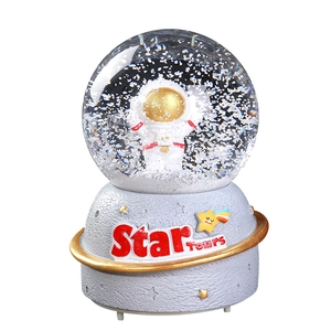 Astronaut snow globe music box with grey moon texture base and Star Tours gold ring