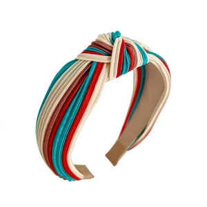 Fashionable knotted headband featuring a multi-color striped design on a white background