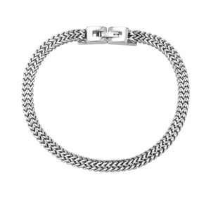 Mens stainless steel silver wheat chain bracelet with secure fold-over clasp on white back