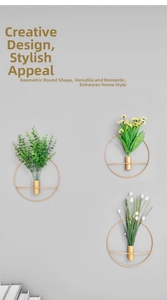 Three gold geometric wall-mounted vases with flowers on a minimalist gray wall