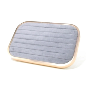 Detailed view of jewelry tray with grey microfiber slots and gold metal frame