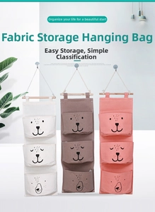 Three-tier wall hanging storage bags in white and brown with minimalist bear face design