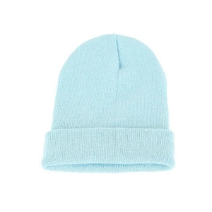 Close-up of light blue knitted beanie with ribbed texture for winter warmth