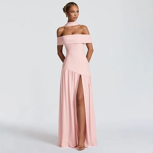 Detail of pink off-shoulder halter dress with high slit and smooth flowing fabric