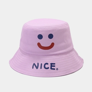 Close-up of lavender cotton bucket hat with blue smiley face and NICE text detail