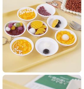 Close-up of realistic 5cm miniature dessert bowls with mango sago and taro balls