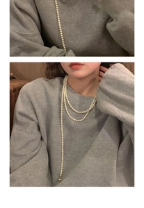 Detail view and model shot of a multi-layer French vintage pearl necklace with gold pendant