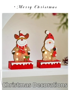 Detail of wooden Christmas ornaments with warm LED lights and festive star cutouts