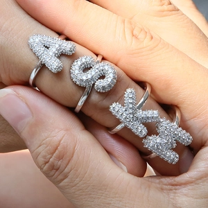 Silver open ring set with bubble letter charms and sparkling white pavé crystals