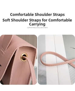 Detail of pink faux leather bag showing thin shoulder strap and gold hardware eyelets