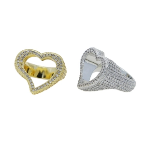 Detail of hip hop hollow heart rings with cubic zirconia in gold and silver finish